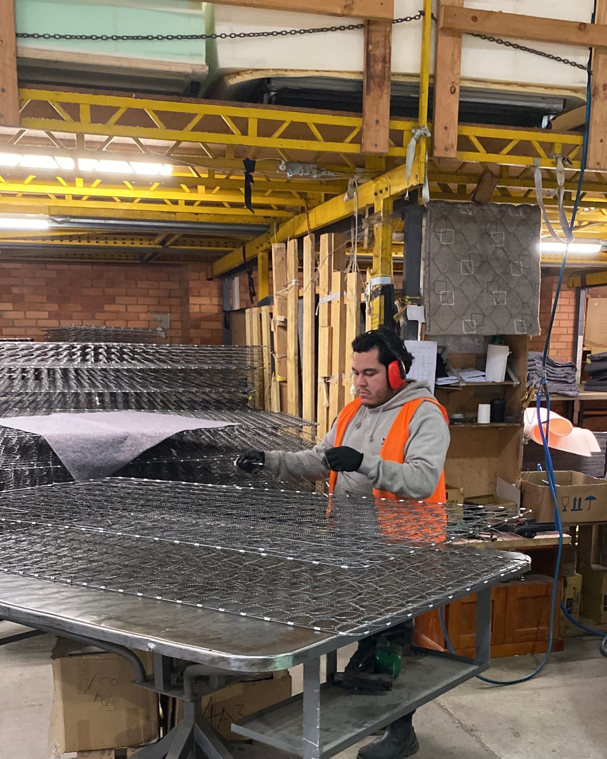 Calima process worker assembling components at a production bench