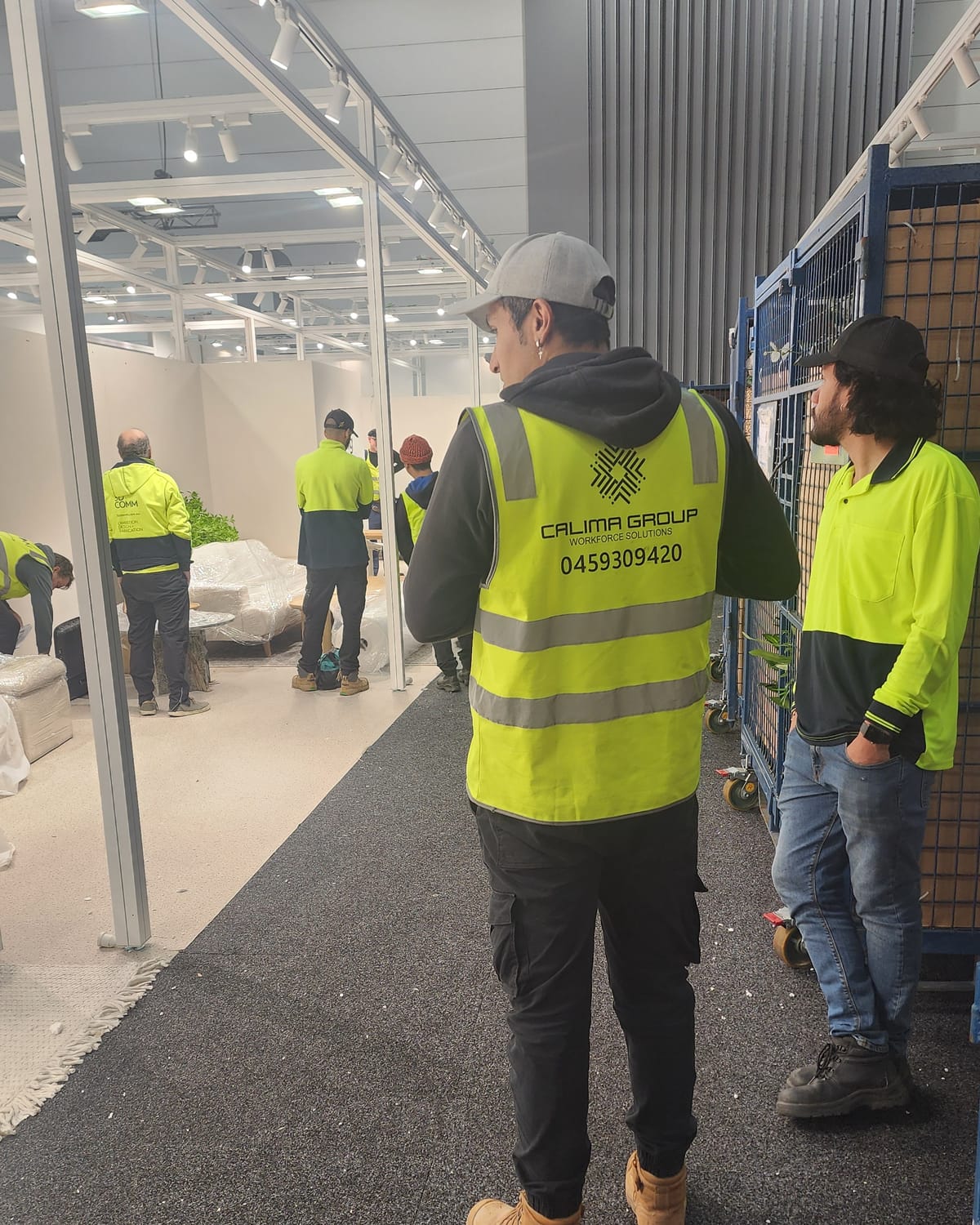Calima crew in branded hi-vis during an exhibition bump-in